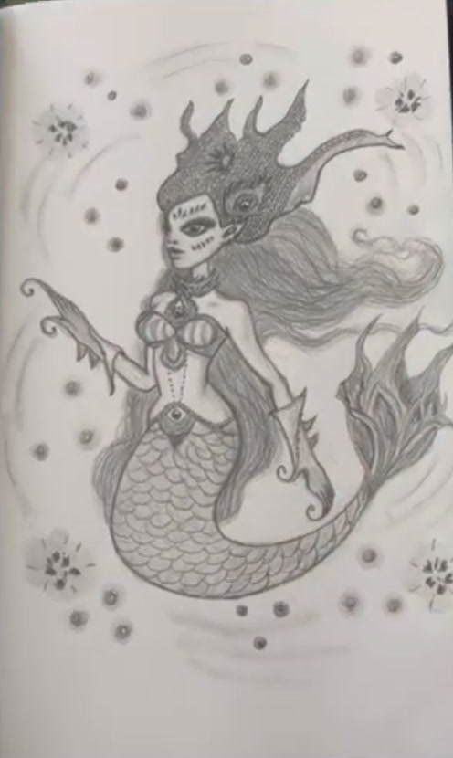 Graphite pencil sketchbook drawing of a fantasy mermaid with a sea-creature crown, flowing hair and scaly tail, by Marah Maitale Art