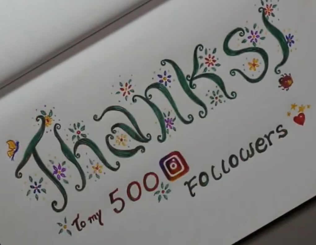 Hand lettering of the word Thanks in green vine-like letters with small colorful flowers, butterflies, a ladybug and the text To my 500 Instagram followers, by Marah Maitale Art